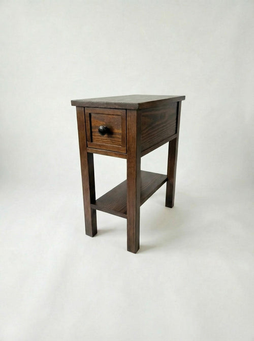Wooden side table with a drawer on a white background