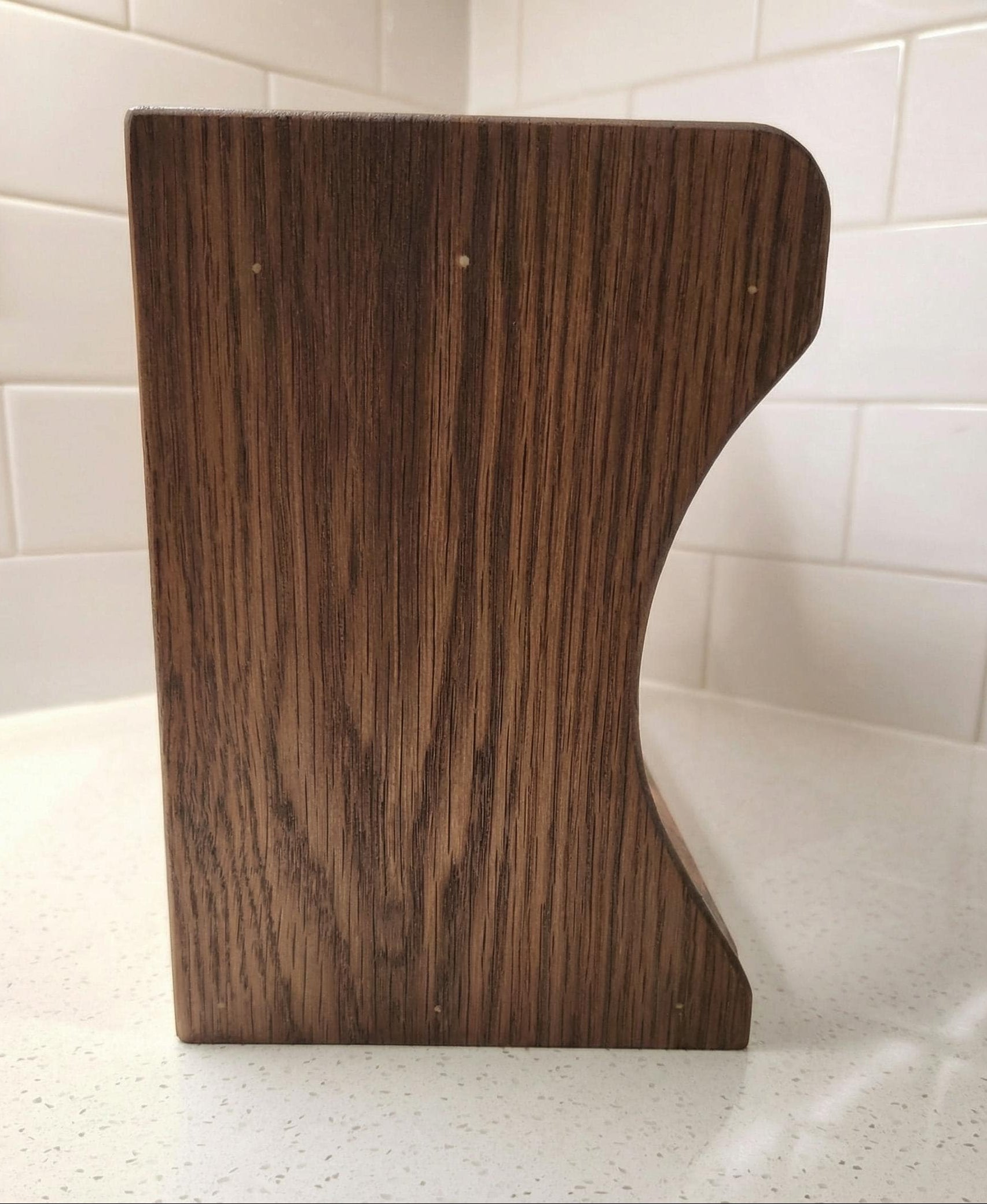 Handmade oak kitchen shelf styled with plants and mugs, natural wood finish