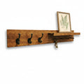 Wooden wall shelf with hooks and a small picture frame on a white background
