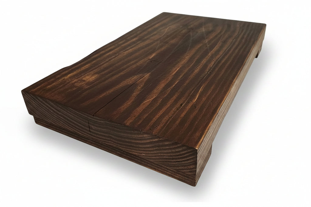 Wooden board with a dark finish on a light background