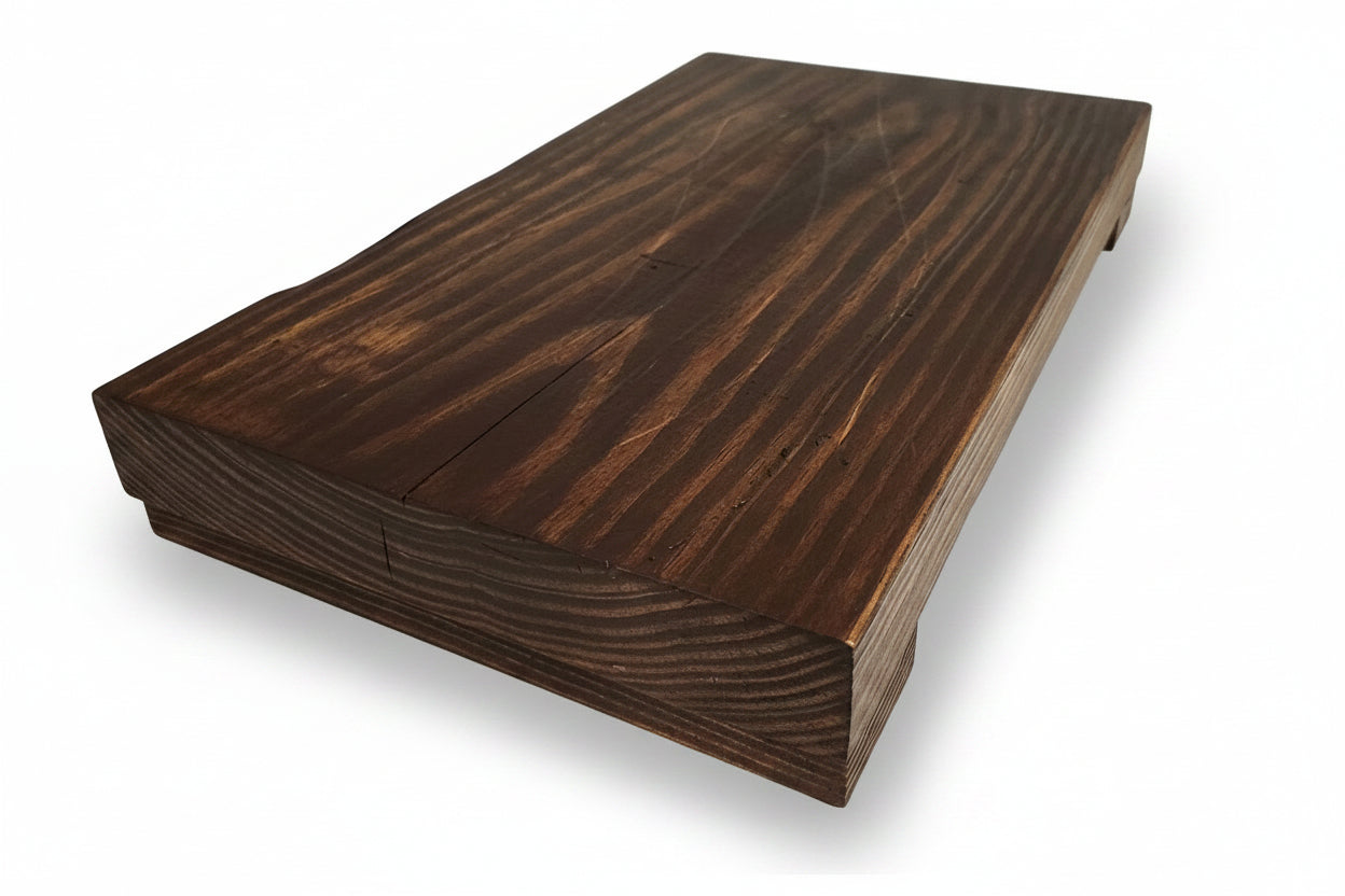 Wooden board with a dark finish on a light background